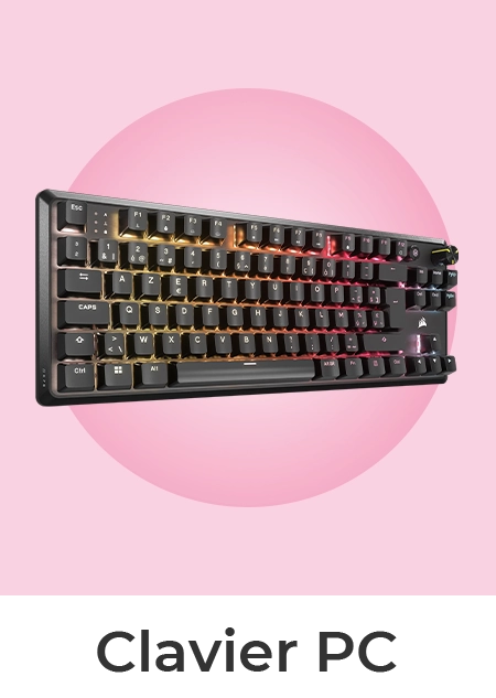 Un clavier PC mécanique noir de la marque Corsair, avec un rétroéclairage RGB multicolore, disposé sur un fond rose.