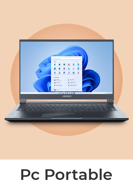 Un ordinateur portable de la marque AORUS ouvert, affichant l'interface Windows 11 sur fond beige.
